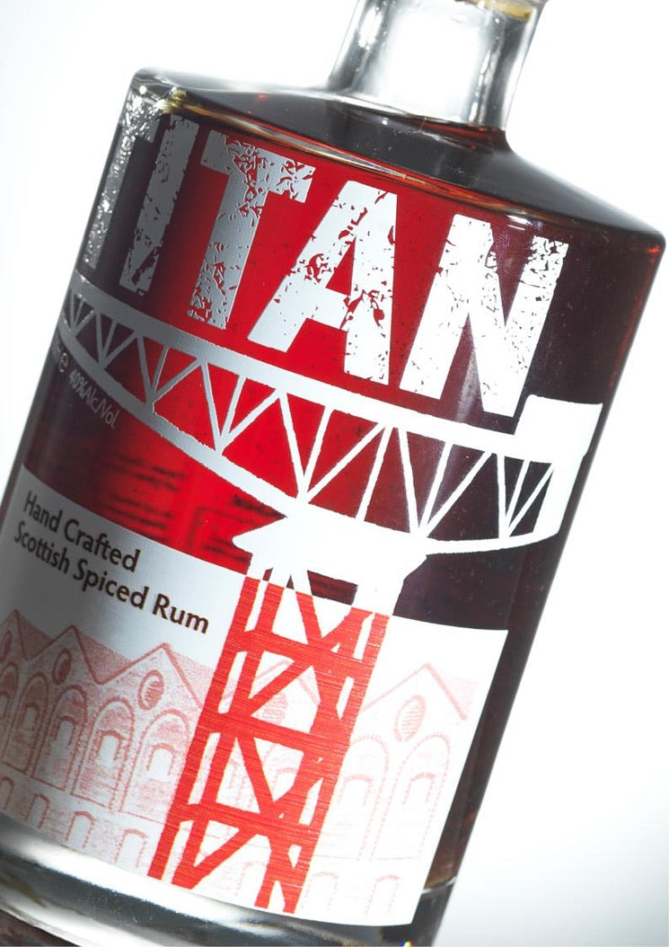 Close-up of the Titan Spiced Rum bottle label featuring the crane logo