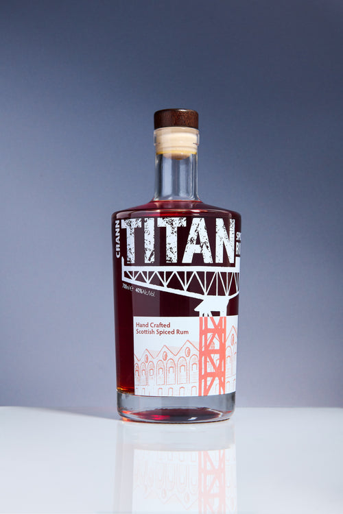 Bottle of Titan Hand Crafted Scottish Spiced Rum on a grey background